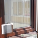 Fixed fly screens fitted to window exterior while standing inside